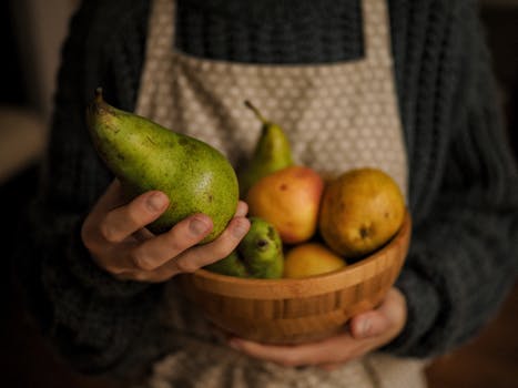 a hand holding a homemade vegan snack bar