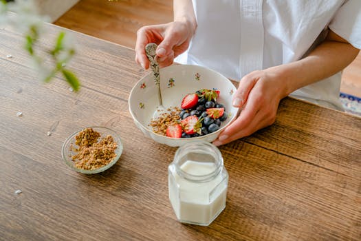 bowl of Greek yogurt topped with mixed nuts